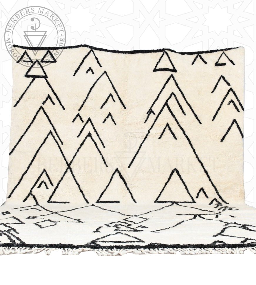 Original ivory Mrirt rug with asymmetric black mountain and chevron motifs