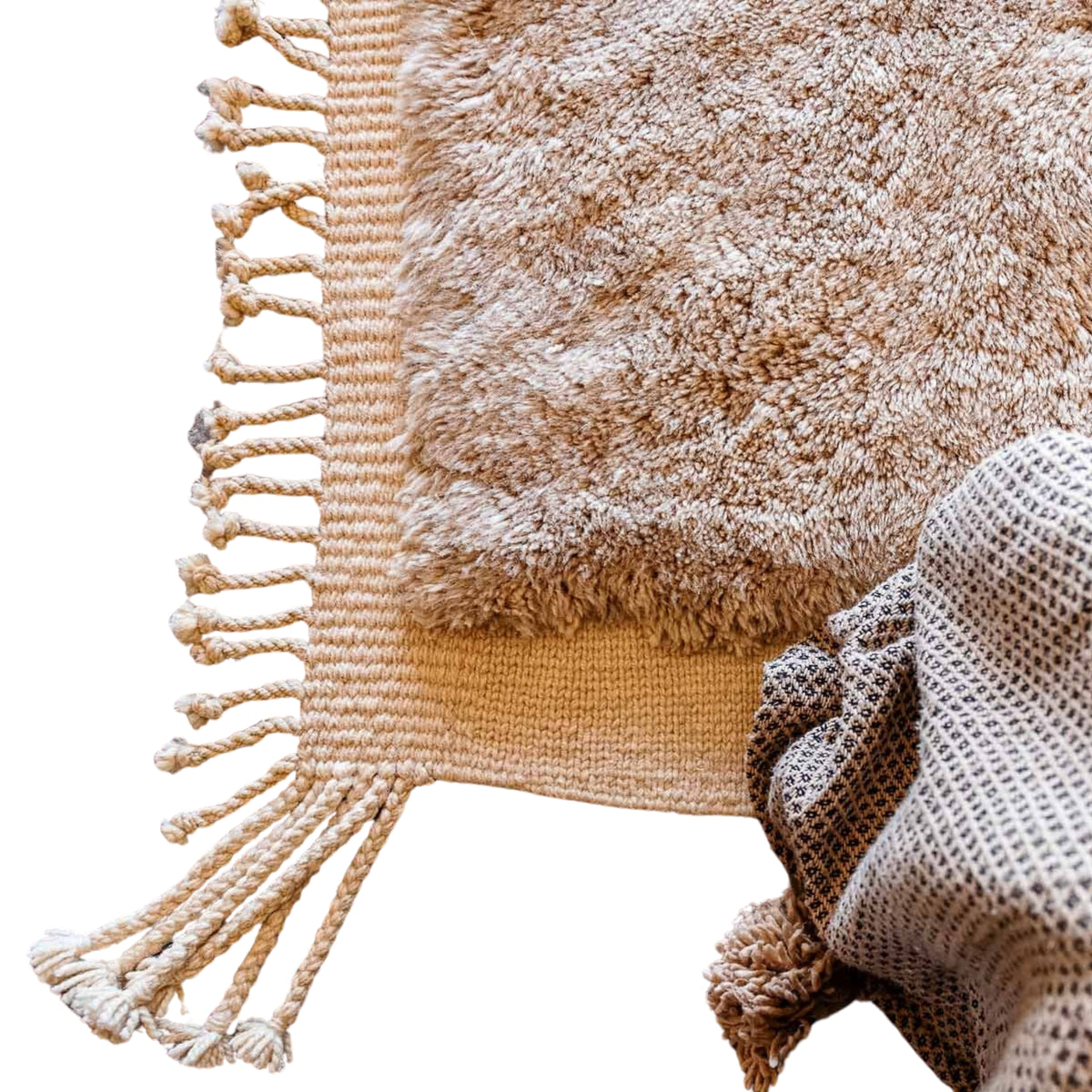 closeup texture Handmade Moroccan wool rug in camel beige and ivory with abstract block motif and fringe