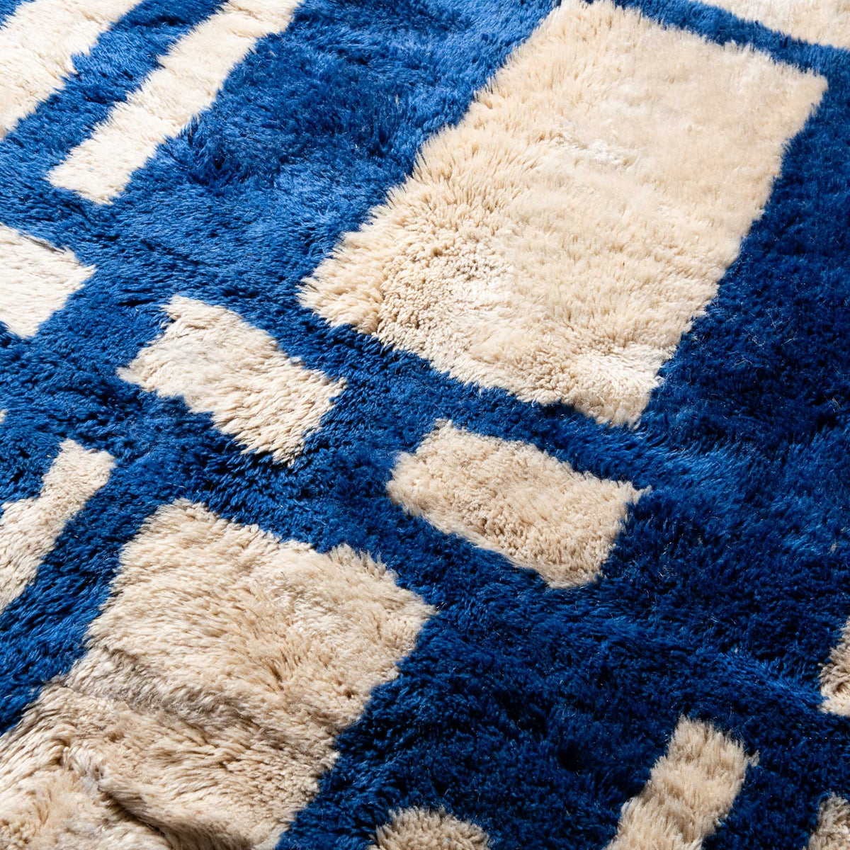 closeup Azure Grid handmade Mrirt Moroccan wool rug in cobalt blue and ivory geometric design