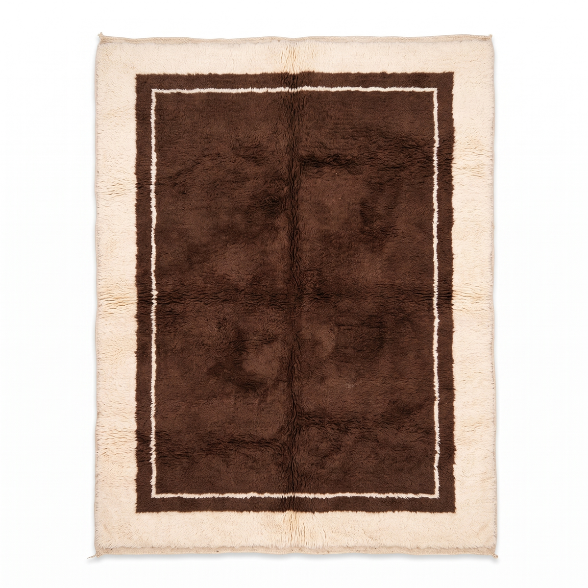 Chocolate brown Moroccan rug with a cream carved border, hand-knotted wool Beni Mrirt shag rug, top view