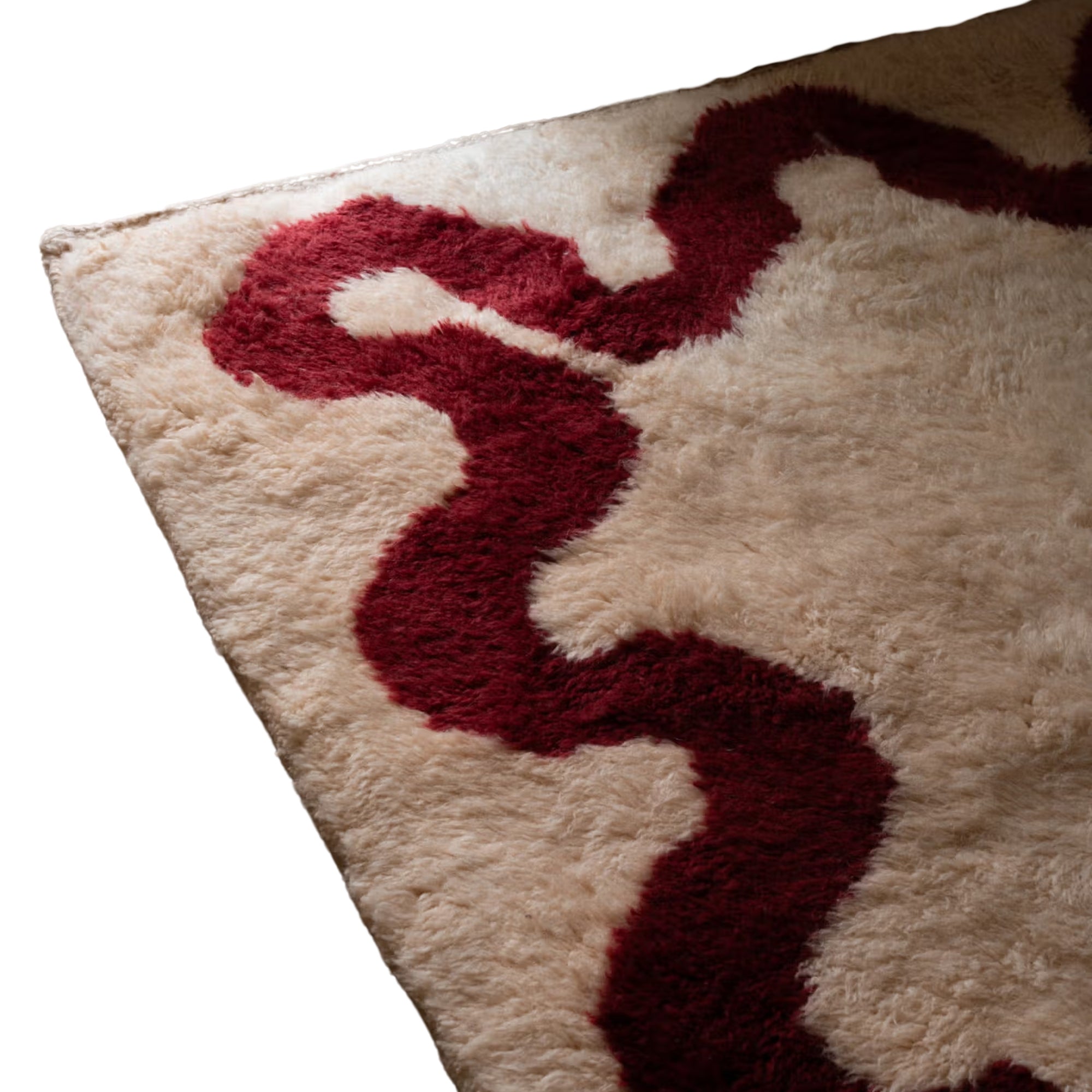 Handmade Moroccan wool rug in cream with garnet-red wavy border and natural fringe