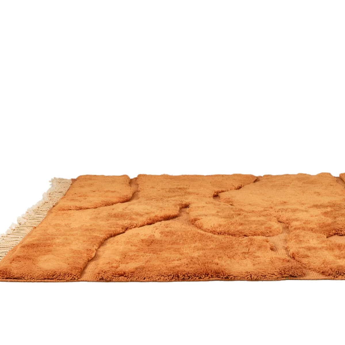 Flatted Handmade Moroccan wool rug in amber orange with organic free-form shapes and fringe