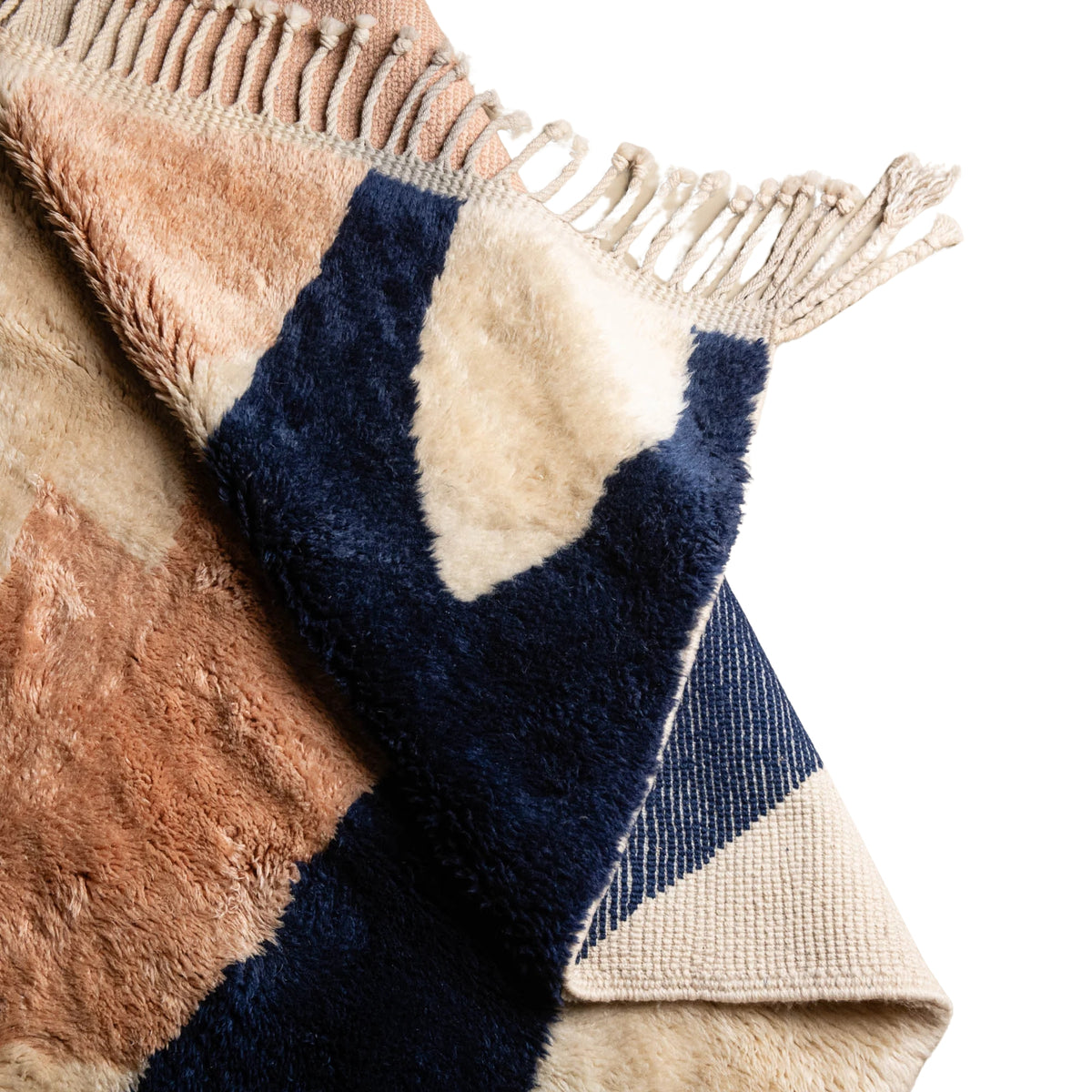 Flipped Handmade Moroccan wool rug blush sand with carved ivory islands and navy stripe