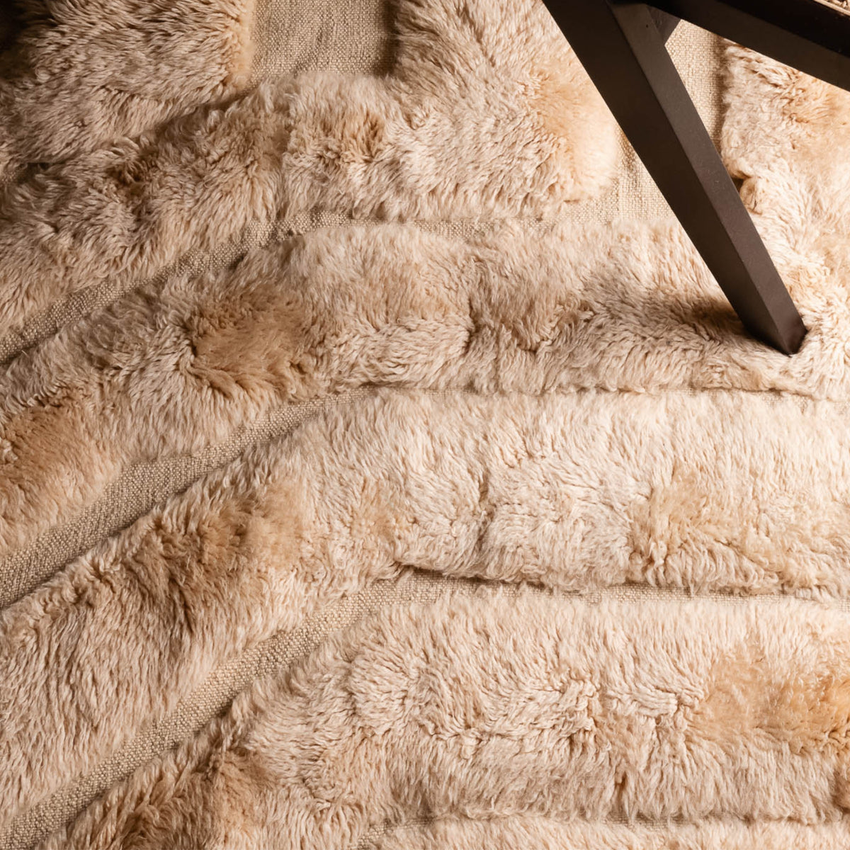 Closeup Handmade Moroccan wool rug in cream beige with concentric tonal ridges