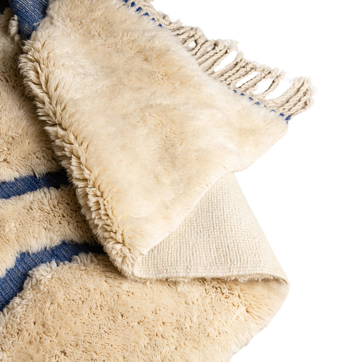 Flipped Handmade Moroccan wool rug ivory with carved indigo freeform vertical lines
