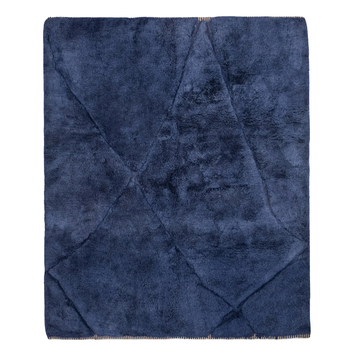 Handmade Moroccan wool rug in deep navy with carved geometric relief lines