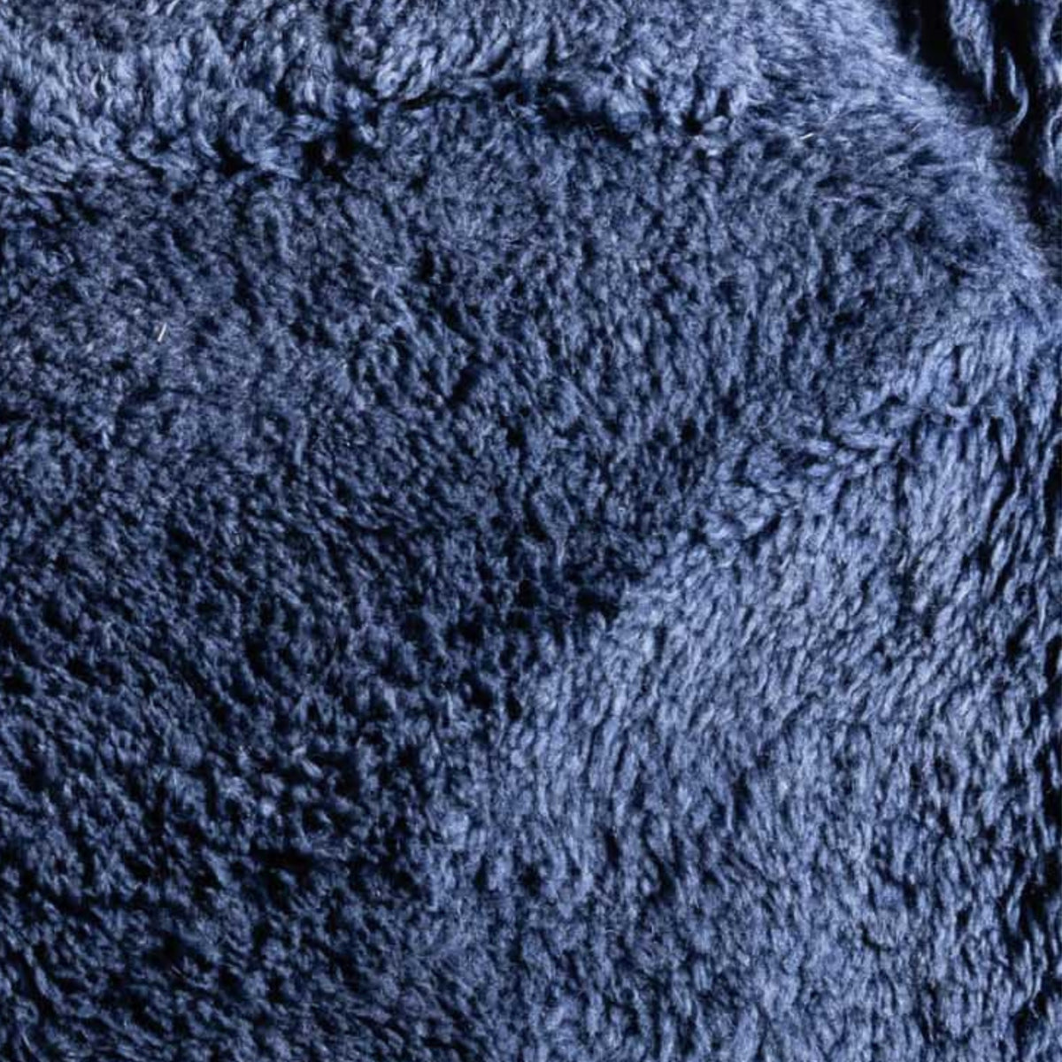 closeup Handmade Moroccan wool rug in deep navy with carved geometric relief lines