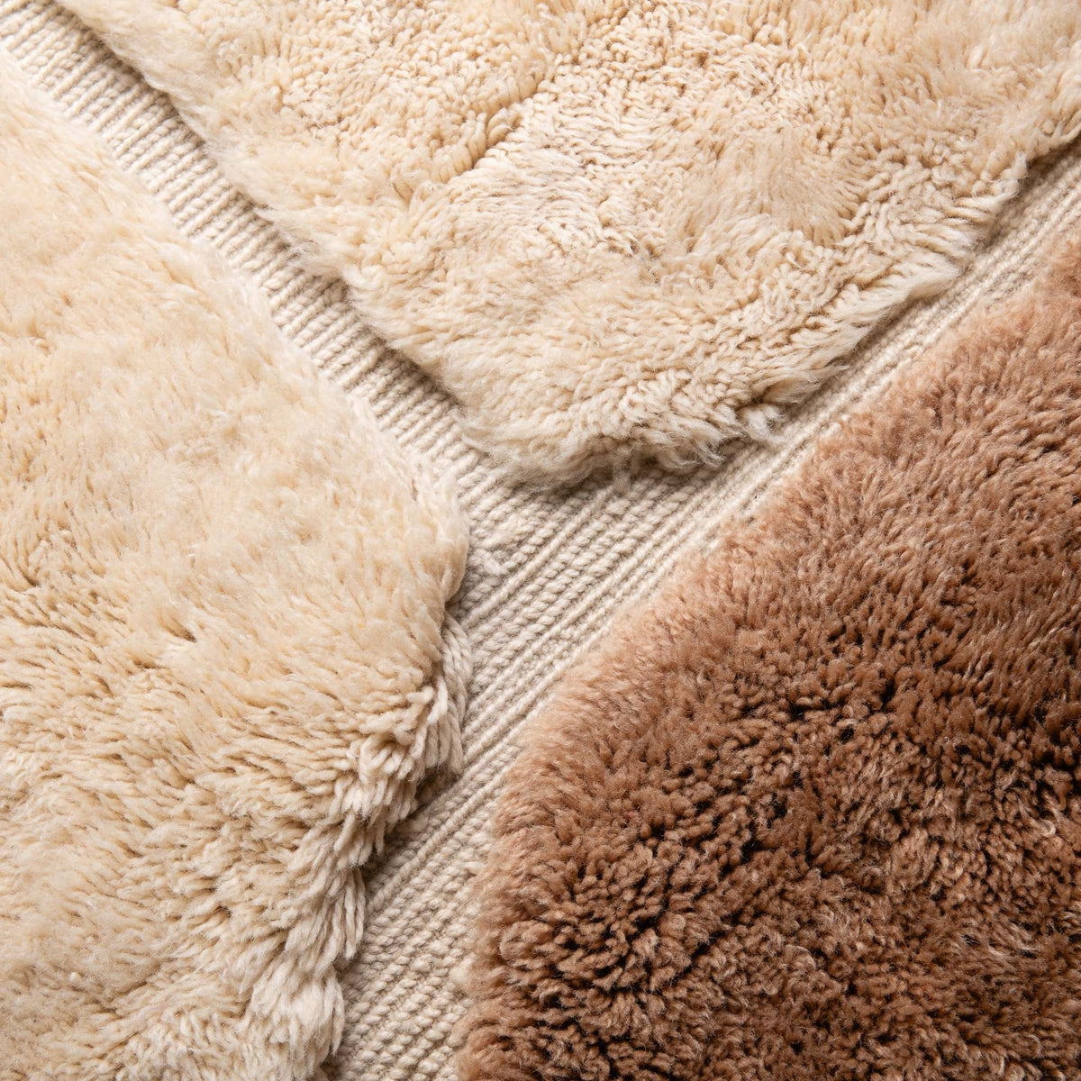 closeup pictureHandmade Moroccan wool rug in ivory cream and camel brown with abstract geometric shapes