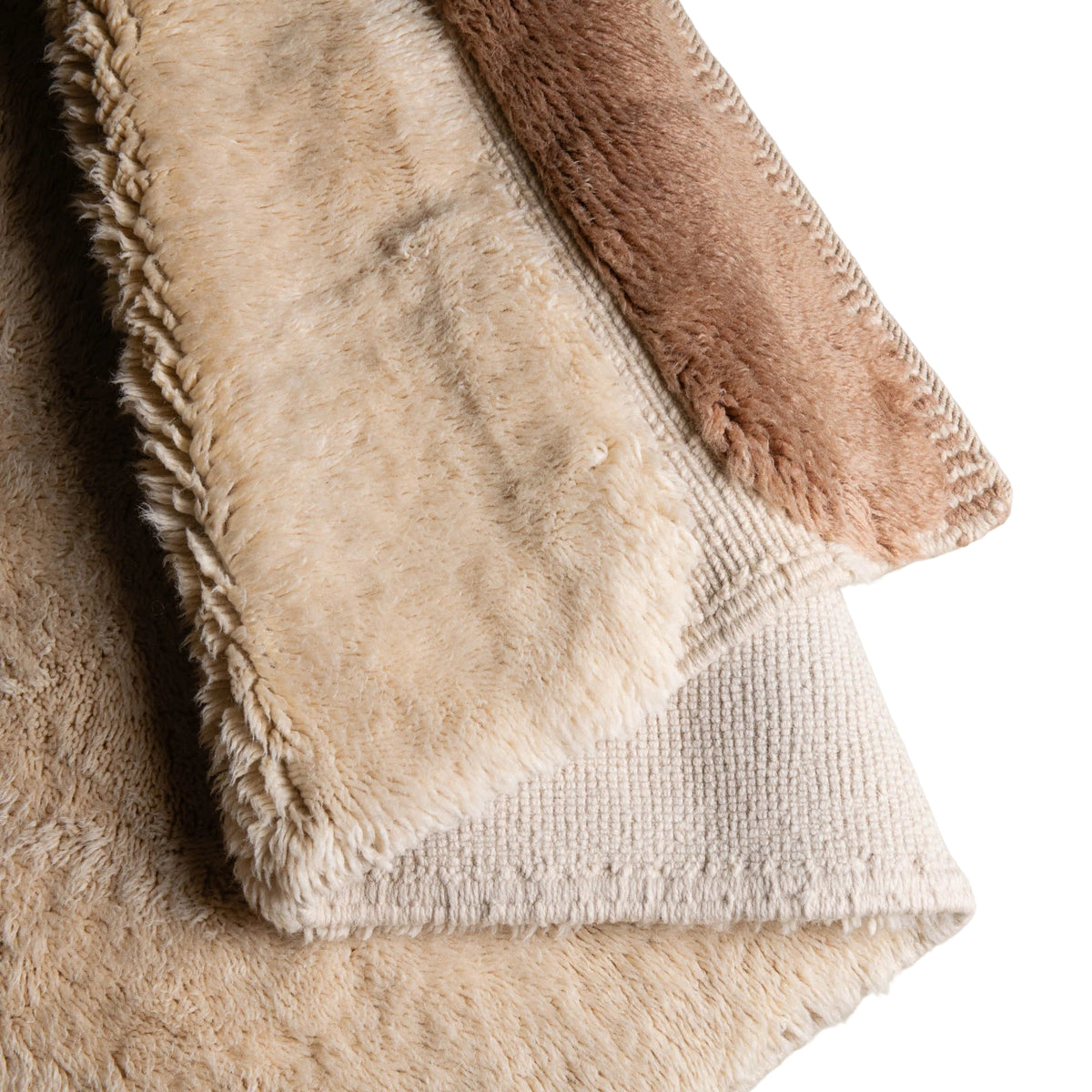 Closeup flipped Handmade Moroccan wool rug in ivory cream and camel brown with abstract geometric shapes